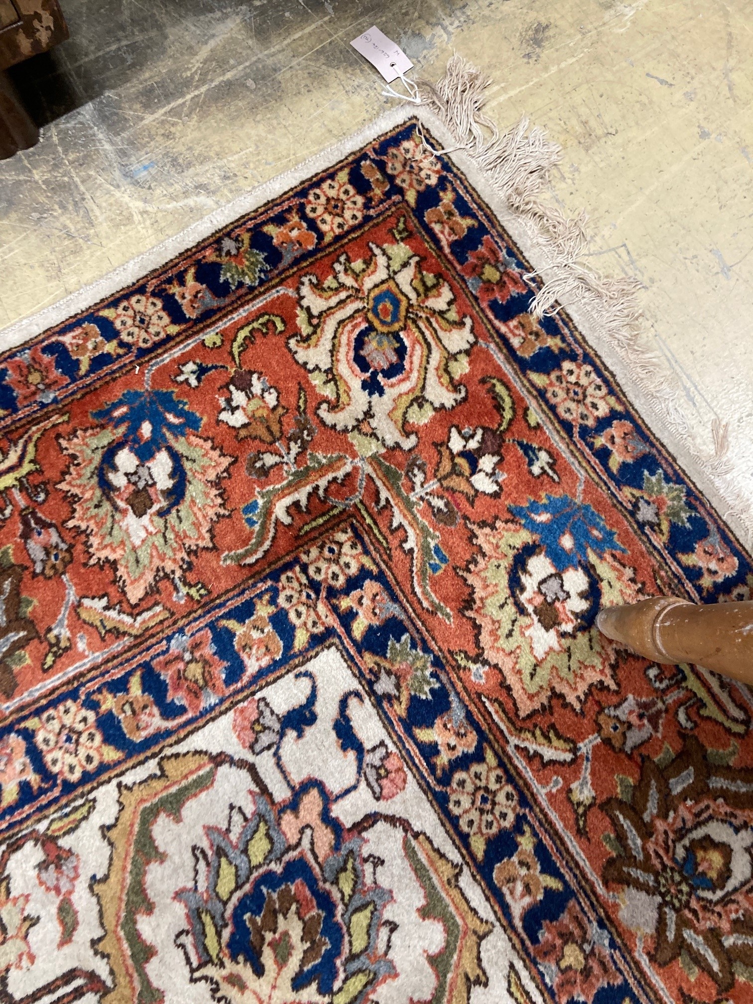 A modern Persian ivory ground rug, 340 x 260cm